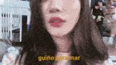 a close up of a woman 's face with guino para mar written in yellow