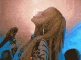 a woman singing into a microphone that says " get off the phone " on it