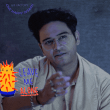a gif of a man with the words leave me alone on it
