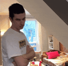 a man in a white shirt with a picture of a cat on his sleeve