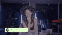 a woman wearing a hat and a bra is sitting in front of a screen that says 0.04 on it