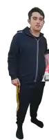 a young man wearing a black hoodie and black pants is standing in front of a white background