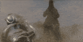 a robot and a monster are fighting each other in a video game .