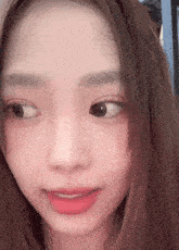 a close up of a woman 's face with her eyes closed and her mouth open