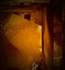 a picture of a fire with the letter t in the lower right corner