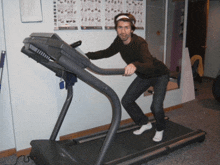 a man on a treadmill with a poster on the wall that says ' exercises ' on it