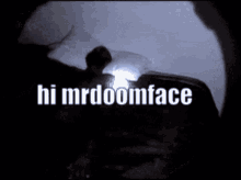 a person holding a flashlight with the words hi mrdoomface written on it