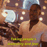a man in a white shirt is talking about taking people 's insecurity and fear