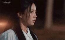 a woman is crying with a tear running down her face .