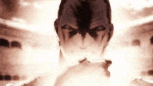 a close up of a person 's face with smoke coming out of their mouth .