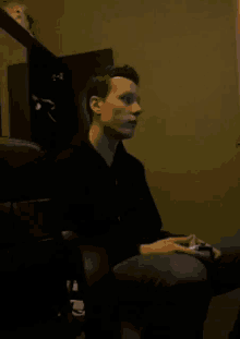 a screenshot of a man 's face with arrows pointing to the right