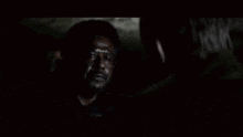 a man is talking to another man in a dark room and saying `` let 's call it war . ''