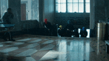 a group of people wearing masks are walking down a staircase
