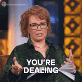 a woman in a green shirt says you 're dealing