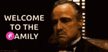 a man in a tuxedo with the words welcome to the family above him