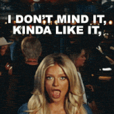a woman making a funny face with the words i don 't mind it kinda like it