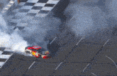 a race car with smoke coming out of it 's exhaust pipe