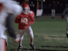 a football player in a red uniform with the number 9 on his jersey
