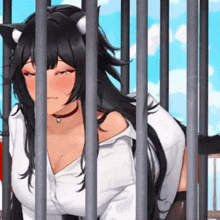 a woman with cat ears is behind bars in a jail cell .