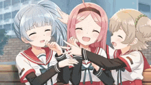 three anime girls are sitting on a bench and one of them is pointing
