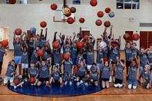 a group of young basketball players wearing shirts that say eagles