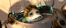 a cartoon character is sitting in a machine with a shield