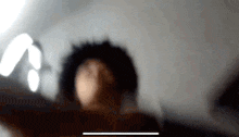 a blurred image of a person 's head with a white border