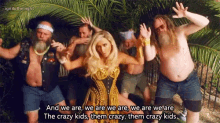 a group of men and a woman are posing for a picture with the caption and we are we are we are the crazy kids them crazy them crazy