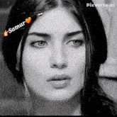 a black and white photo of a woman 's face with the name samar written on it