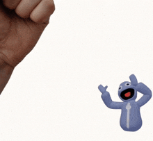 a man 's fist is holding a toy that has the letter i on it
