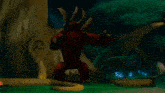 a red dragon is standing next to a tree in a forest .