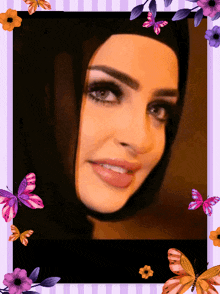 a woman wearing a hijab is surrounded by butterflies and purple flowers