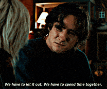 a man talking to a woman with the words we have to let it out