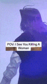 a woman is standing in front of a sign that says i see you killing a woman