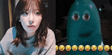 a woman next to a picture of a green monster with smiley faces on it