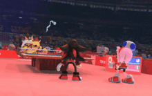 shadow the hedgehog is playing ping pong in a tokyo 2020 stadium