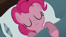 pinkie pie from my little pony is sleeping on a bed