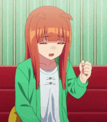 a girl with orange hair is wearing a green shirt