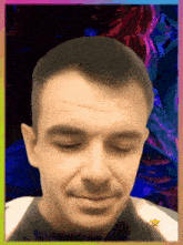 a close up of a man 's face with a star in the middle