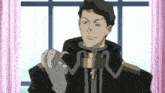 a man wearing a black jacket and white gloves is smiling and holding something in his hand
