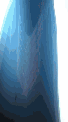 a close up of a blue object with a white border