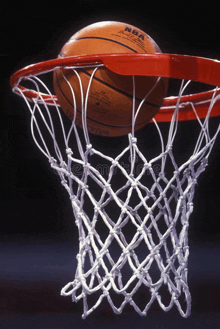 an nba basketball is going through a net