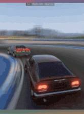 two cars are racing on a track and one has a license plate that says ' aa ' on it