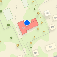 an aerial view of a residential area with a red building labeled 121