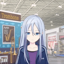 a girl is standing in front of a sign that says trombone