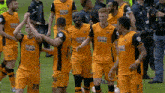 a group of soccer players wearing flamingo land uniforms