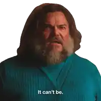 a man with a beard is wearing a blue sweater that says it can 't be