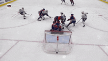 a hockey game is being played with the sn logo in the corner