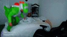 a person in a green costume is jumping on a bed