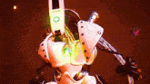 a purple object is flying in the air next to a green object with a circle on it .